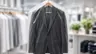 Dark two-piece suit on a hanger