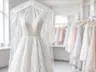 Cleaned lace wedding gown in a clear garment bag